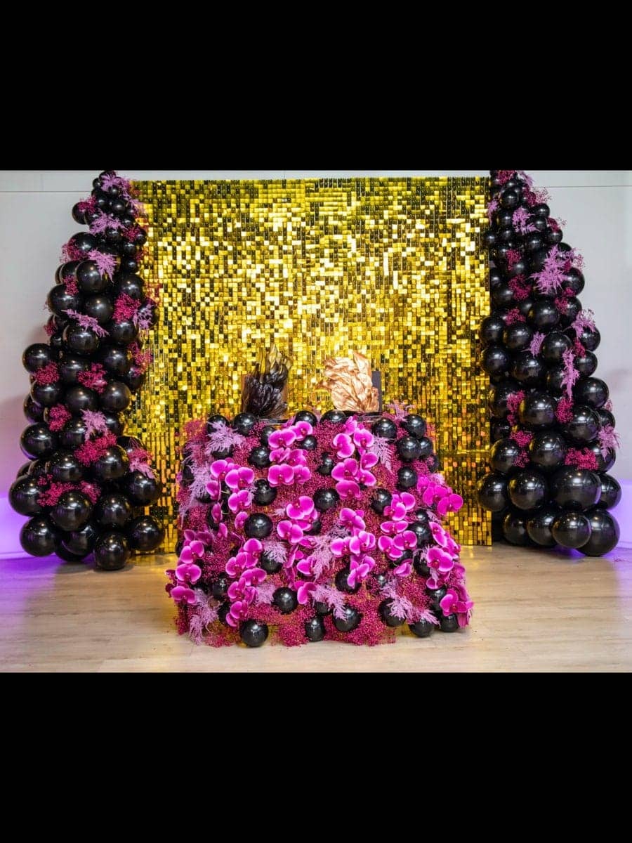 Elegant purple luxury party decoration and balloon setup by Party Boutiques